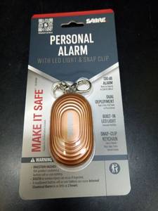 lot 1174 image: SABRE 2-in-1 Personal Alarm with LED Light  Auto Keychain  2.5 in x 1.5 in x 1.5 in  Rose Gold  1 Ct - Retail $15