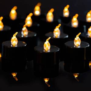 lot 116 image: LANKER 24 Pack Black Tea Lights Candles, Flickering Warm Yellow Flameless LED Tealights, Long Lasting Battery Operated Fake Candles, Decoration for Wedding, Halloween and Christmas - Retail $10