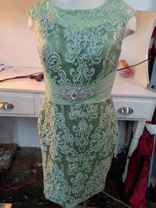 lot 65 image: Sage Green Embroidered Lace Cocktail Dress with Rhinestone Belt