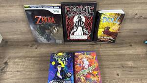 lot 209 image: Mixed Book Collection - Gaming Guides, Fantasy Novels, and Young Adult Fiction