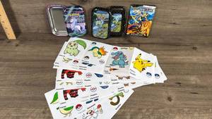 lot 218 image: Pokemon Trading Card Game Tin Collection with Sticker Sheets