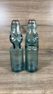 lot 258 image: Glass Codd Bottles with Marble Ball Stoppers - Set of 2