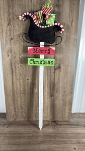 lot 407 image: Christmas Santa Sleigh Yard Sign with Candy Cane Decorations