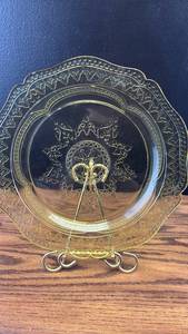 lot 5454 image: Amber Depression Glass Decorative Plate with Ornate Scroll Pattern