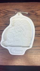 lot 5479 image: Longaberger Pottery Santa Cookie Mold with Gold Ribbon