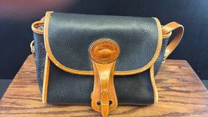 lot 5442 image: Dooney & Bourke All Weather Leather Crossbody Bag