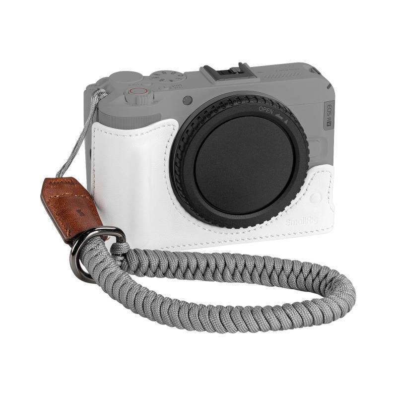 lot 16220 image: Leather Half Case Kit for Canon R50 V with Half Genuine Leather Case and Woven Wrist Strap, Ergonomic Grip, Portable and Protecting (White) - 5431 - Retail $31