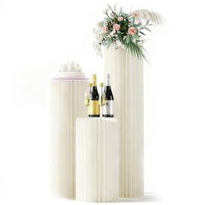 lot 4393 image: 3 Pack Portable White Cylinder Stands for Party, 31.5, 23.6, 15.7 Height Foldable Cardboard Tall Cake Pedestal Stand Flower Floral Pillar Table Stand, cilindros para fiestas redondos blancos for Wedding Parties - Retail $84