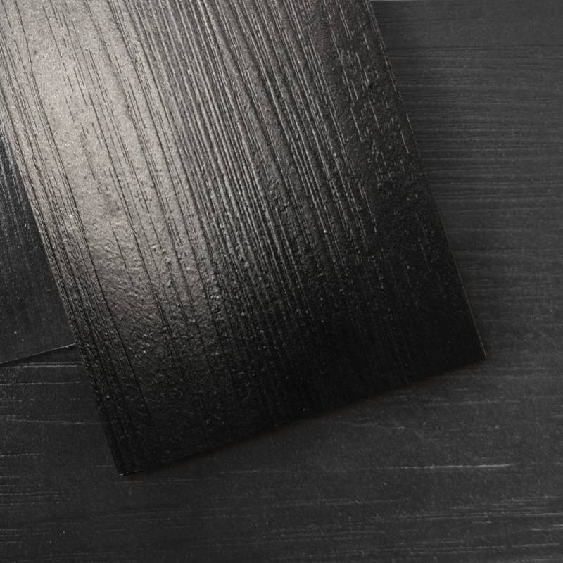 lot 2056 image: Art3d 36-Pack 54 Sq.ft Peel and Stick Floor Tiles Vinyl Plank Flooring Wood Look, Adhesive and Waterproof Tile Sticker for Bedroom, Living Room, Kitchen, RV in Black - Retail $80