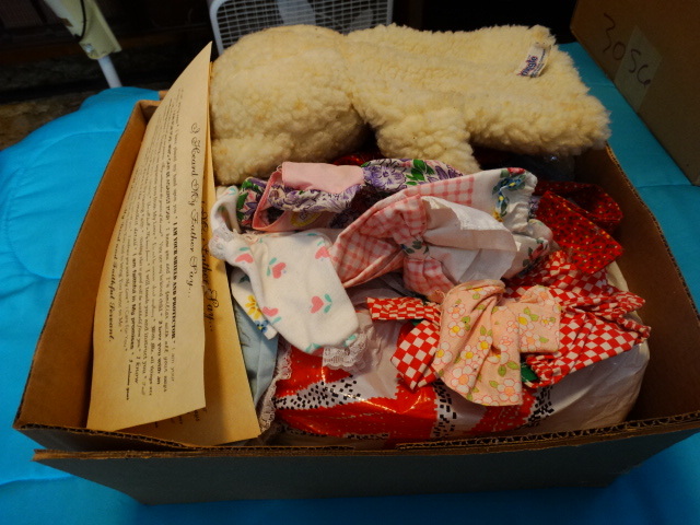 lot 14663 image: Doll and doll clothes.