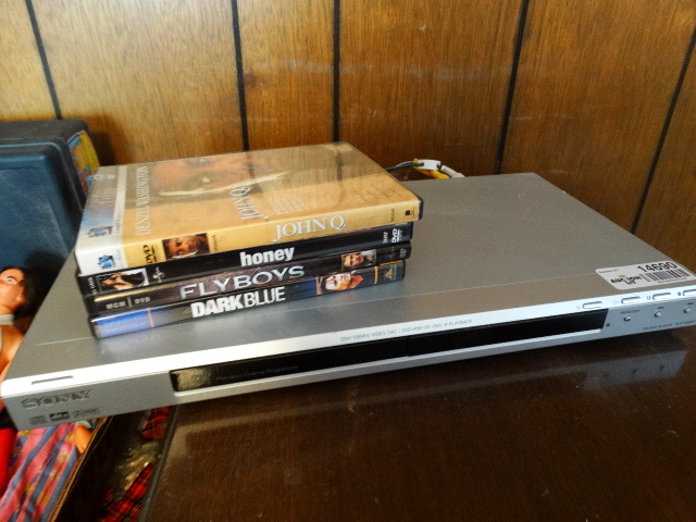 lot 14690 image: Sony dvd player with dvds.