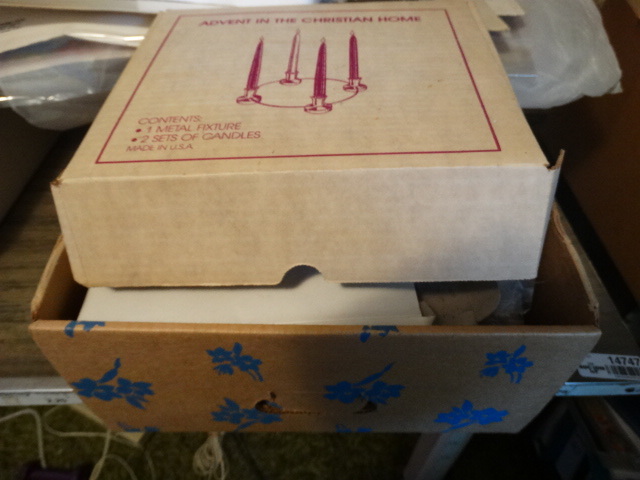 lot 14727 image: Lot of candles, candle holders, cd player, buttons, & more.