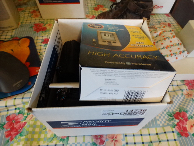 lot 14736 image: Lot with blood glucose monitor, one touch ultra test strips and more.