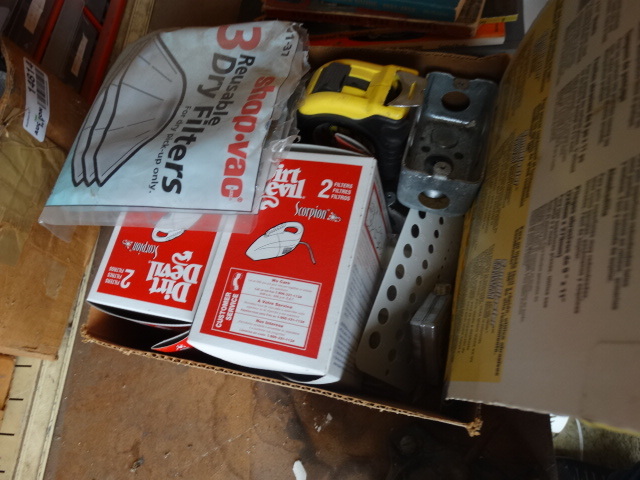 lot 14817 image: Tape measure, sand paper, dirt devil filters and more.