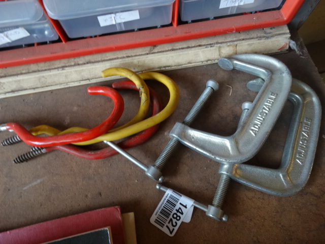 lot 14827 image: 2 C clamps and rubber hooks.