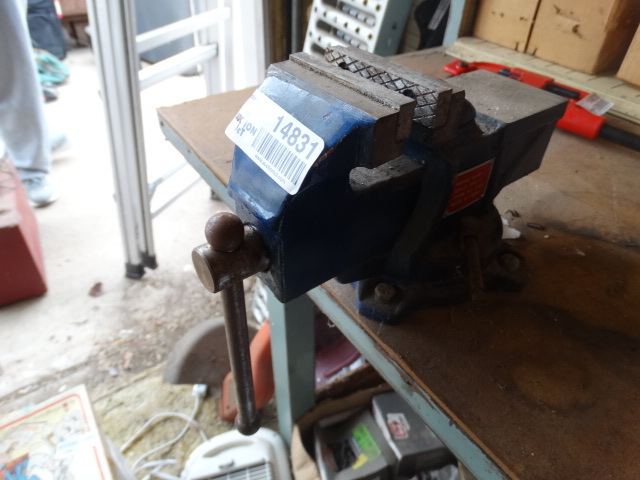 lot 14831 image: Swivel base bench vise and work bench, contents not included.