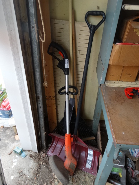 lot 14832 image: Weed eater, snow shove, rack and outdoor broom.