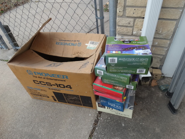 lot 14837 image: 4 Boxes of new c7 lights, 2 boxes of new light holders 10 clear lighted speres and a lighted garland.