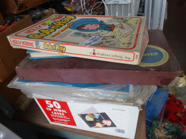 lot 14854 image: Holly hobby rub and play magic transfer set, scrabble puzzles, book and assorted cd trays empty.