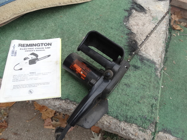 lot 14855 image: Remington electric chain saw 3.25 hp.