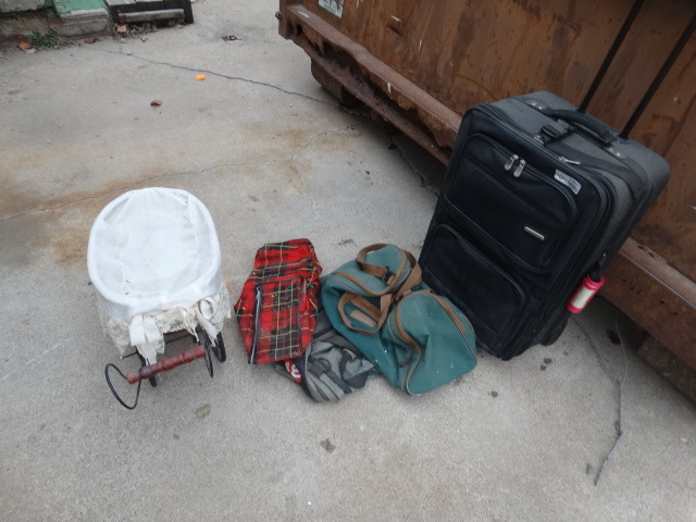 lot 14857 image: Assorted luggage and small baby doll carriage.