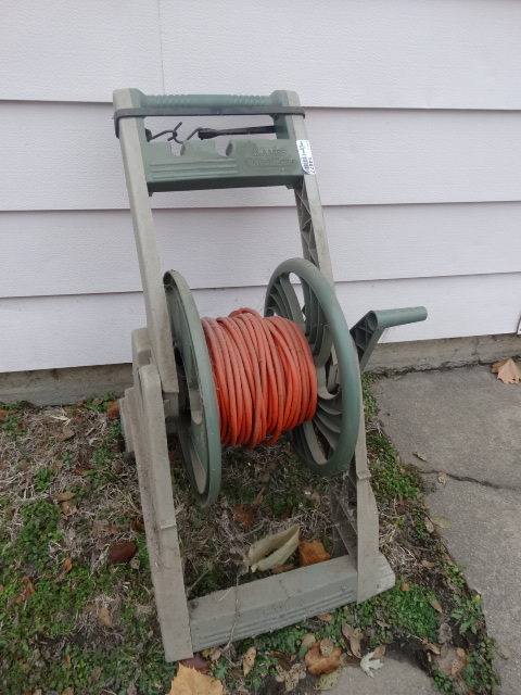 lot 14877 image: Hose reel and hose.