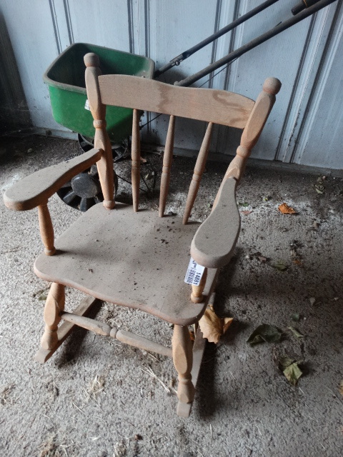 lot 14881 image: Kid size wooden rocking chair.