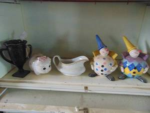 lot 4930 image: Contents of shelf-glass clown banks, amethyst dancing lady vase