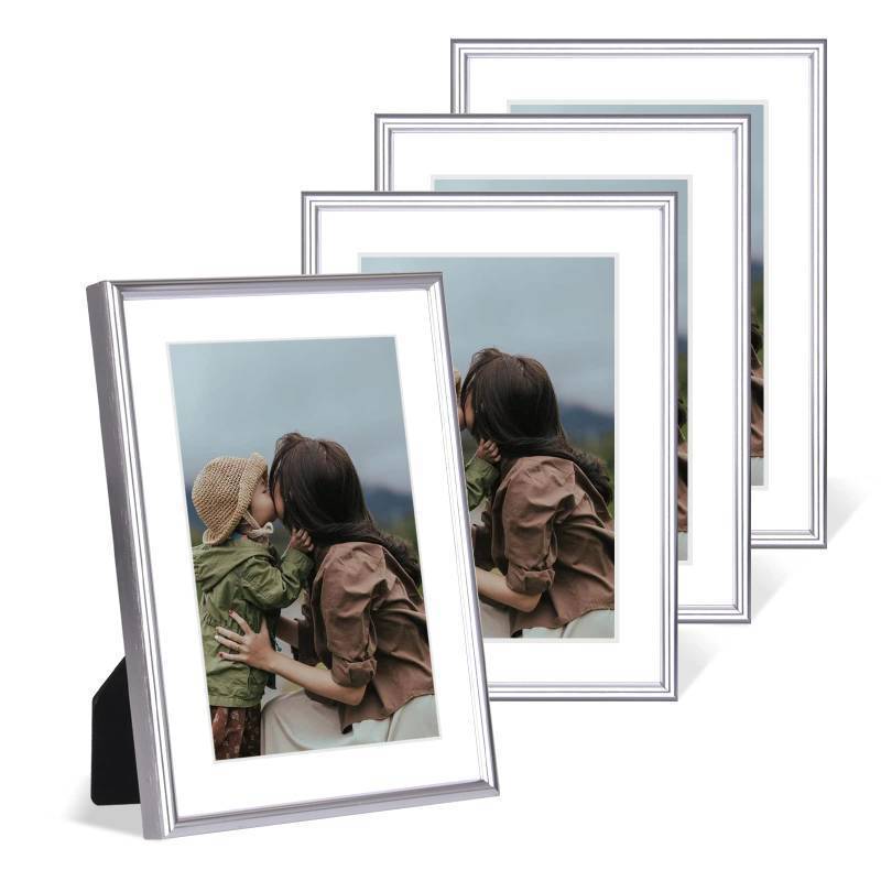 lot 44847 image: 5x7 Picture Frame Set of 4, Matted Silver Simple Modern Brushed Thin Aluminum Metal Photo Frame Fits 3x5 and 4x6 with Mat or 5 x 7 without Mat . Vertical and Horizontal for Tabletop and Wall Mounting - Retail $30
