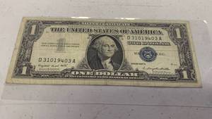 lot 24 image: One Dollar Silver Certificate Blue Seal Series 1957 A Serial number D31019403A