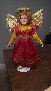 lot 3280 image: Porcelain Angel Doll with Golden Wings and Red Brocade Dress