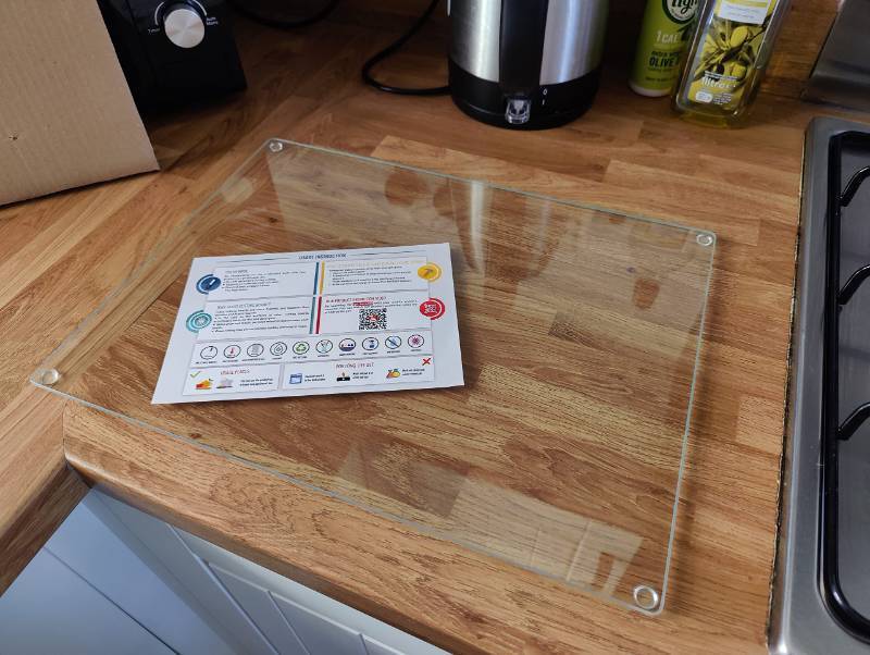 lot 41501 image: Kitchenville Glass Cutting Board 16x12 Tempered Glass Kitchen Counter Protector - Durable- Scratch-Resistant, Heat-Proof - Clear Design - Retail $15