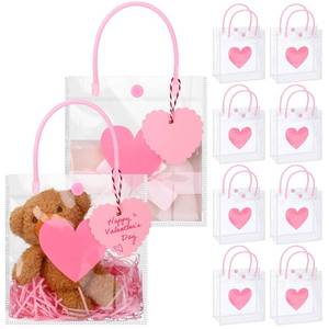lot 24345 image: Bulyoou 24 Pcs Valentines Day Clear Gift Bags Bulk with Handles 6 x 2.8 x 6.3 Small Valentines Transparent PVC Plastic Tote Goodie Heart Bags with Ribbons for Wedding Party Birthday(Pink) - Retail $20