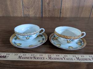 lot 23 image: Japanese Porcelain Tea Cup and Saucer Set with Fruit Pattern