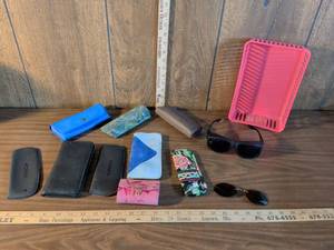 lot 61 image: Assorted eyeglass holders pair of sunglasses pair of sun clip-ons