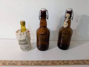 lot 245 image: Grolsch Swing Top Beer Bottles with Jacobs Revenge Bottle Puzzle Bag