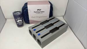 lot 104 image: Mixed items lot of 3 iFLY Packing Cubes 4-Piece Set with Novelty Travel Mug and a metal foil dispenser