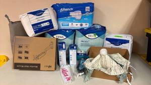 lot 157 image: Mixed Lot of Adult Incontinence Products and Monitor Mount&nbsp