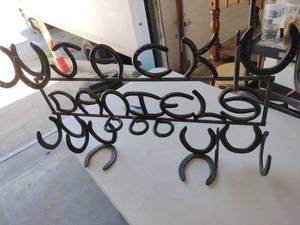 lot 59322 image: Hand Made Horseshoe Rack with Jack Daniels Logo
