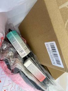lot 421457 image: 15 Item Mystery Bag (misc. makeup, phone accessories, electronics, toys, stuffed animals, keychains, household items, etc.)
