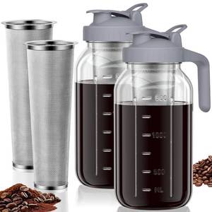 lot 11794 image: Cold Brew Coffee Maker Jar - 64oz Thick Glass Multipurpose Mason Pitcher Spout Lid with Handle & Stainless Steel Filter for Iced Coffee, Lemonade, Ice Tea, Homemade Fruit Drinks Container��2Pack��(One Has Small Chip On Top)