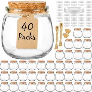 lot 5421 image: Syntic 40 Pack Small Glass Jars with Cork Lids, 7oz Empty Mason Jars for Making Candles, Yogurt Container with PE Lids for Wedding Favors, Baby Shower, Candy, Spices with Twine, Labels incomplete