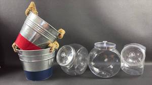 lot 101 image: (3) Plastic Display Jars and (2) Metal Buckets with Rope Handles- Red and Blue