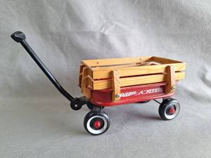 lot 64 image: Radio Flyer Mini Red Wagon with Wood Rails