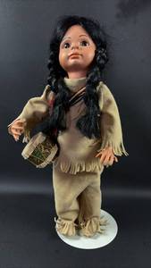 lot 19 image: Full Porcelain Native American Doll with Traditional Clothing and Bead Detail Approximately 14 Inches Tall