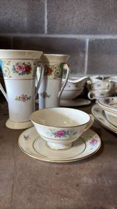 lot 29 image: Vintage Lenox Rose (14) Saucers (14) Footed Tea Cups (1) Gravy Boat (2) Centerpiece Vases (1) Oval Serving Platter 13.5 inches Long (2) Serving Bowls (bring packing and boxes to pickup)