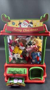lot 30 image: Christmas Crane Machine Toy With Digital Display and Sound Chock Full of Christmas Themed Plushies and Rubber Ducks with Reusable Tokens