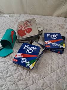 lot 114 image: Phase 10 Card Game in Metal Tin