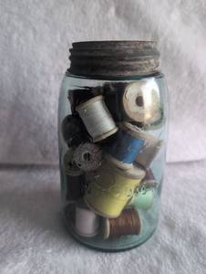lot 1014 image: Mason Jar with Sewing Thread Collection