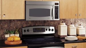 lot 1038 image: GE Profile Stainless Steel Over-the-Range Microwave - Retail $400